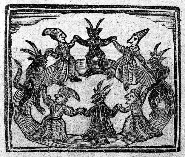 Witches dancing with devils from the History of Wizards and Witches 1720